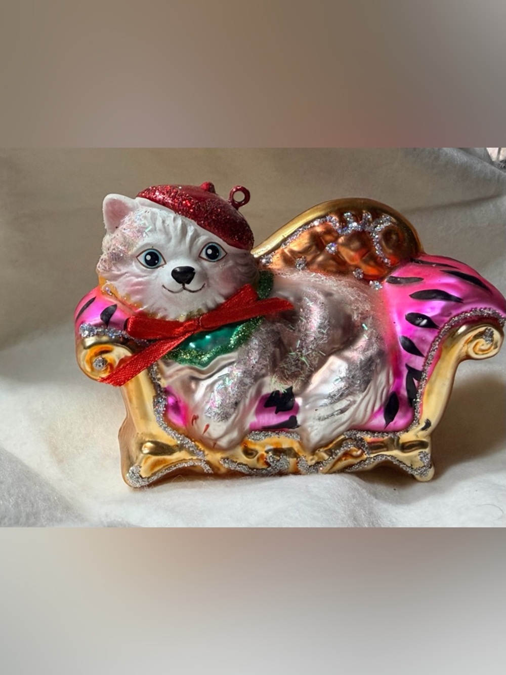 Glass Cat Ornament on Pink and Gold Chaise